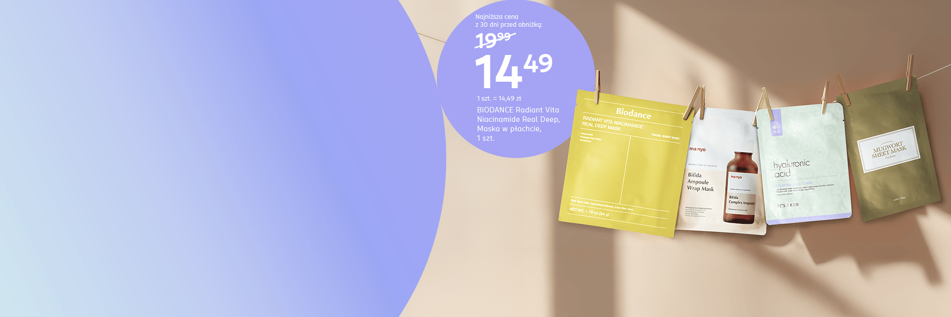 Maska w płachcie Biodance Radiant Vita w cenie 14,49 zł, obok niej maseczki ma:nyo, It's Skin i I'm From Mugwort przewieszone na sznurku na tle beżowej ściany. Promocja online w drogerii Rossmann.